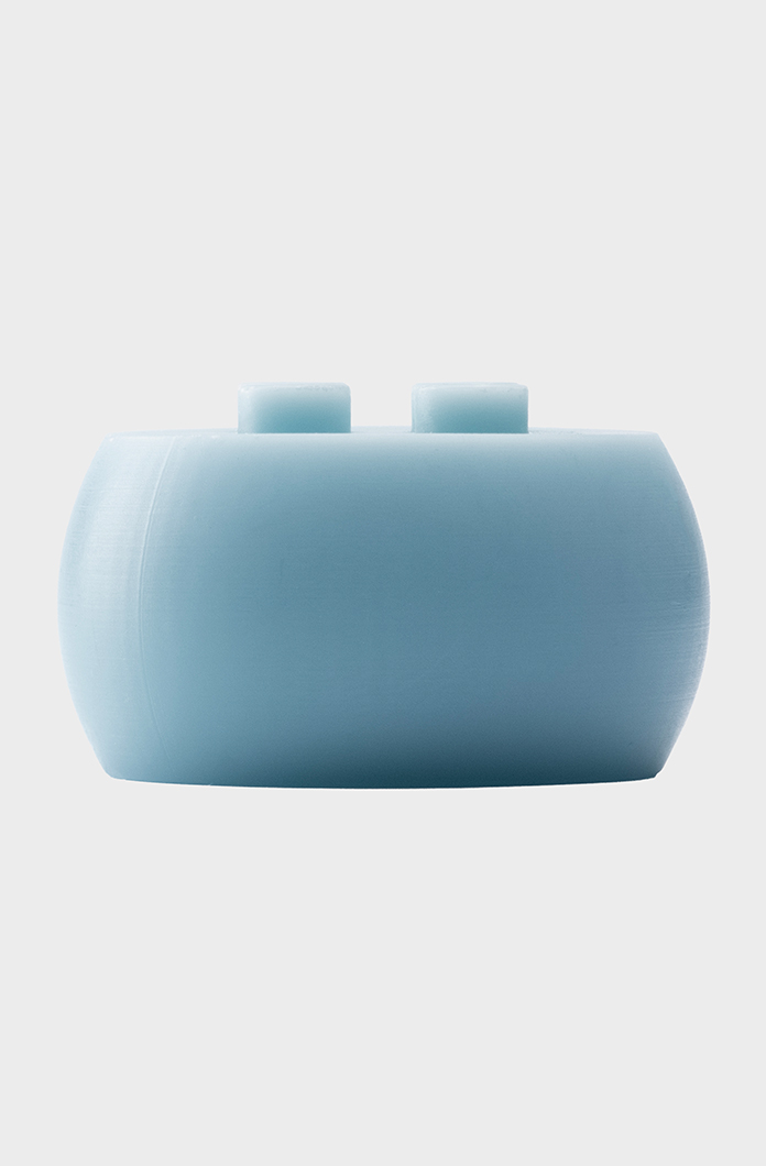 Light blue oval candle with a minimalist design and smooth texture isolated on white background ideal for modern and stylish accessory collections.