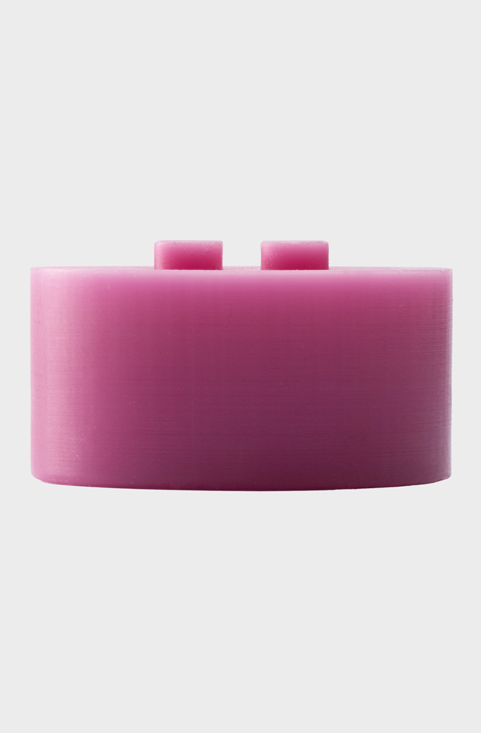 Pink oval-shaped candle with a smooth surface displayed on a neutral background. The minimalistic design makes it suitable for modern decor or craft projects.