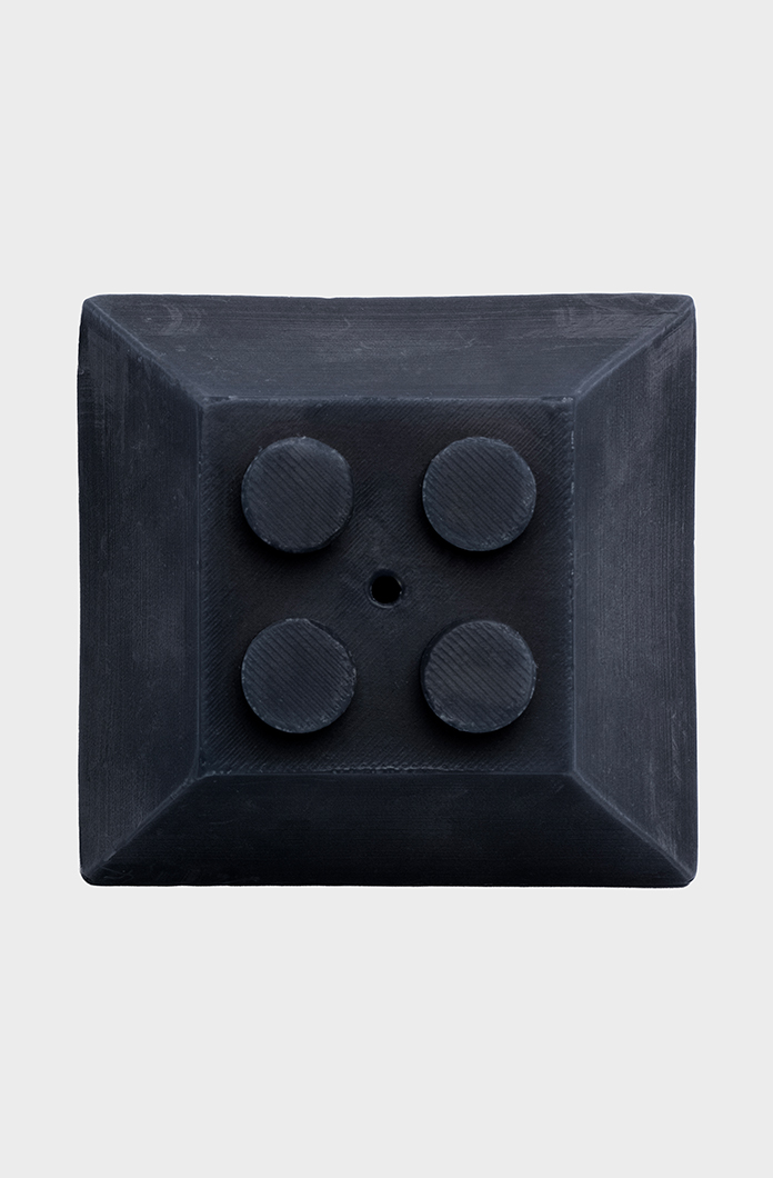 An image of a black square rubber bumper featuring a pyramid-shaped design with four circular protrusions on a white background suitable for industrial applications.
